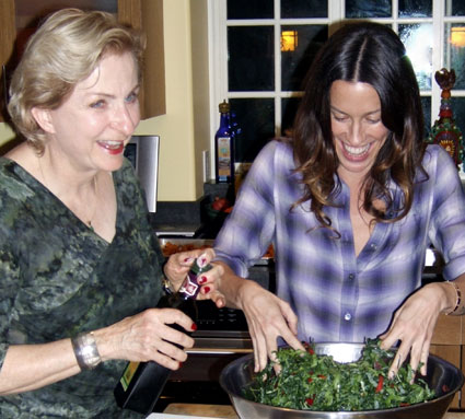 Anna Thomas and Alanis Morissette make kale salad. Photo: Media Bistro